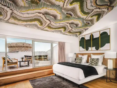 Un ou plusieurs lits dans un hébergement de l'établissement Maisons du Monde Hôtel & Suites - La Rochelle Vieux Port