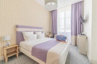 Un ou plusieurs lits dans un hébergement de l'établissement Hotel Heritage