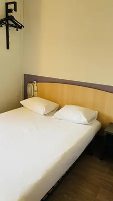 Un ou plusieurs lits dans un hébergement de l'établissement Premiere Classe Niort Est - Chauray