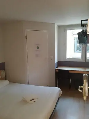 Un ou plusieurs lits dans un hébergement de l'établissement Premiere Classe Niort Est - Chauray