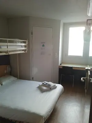 Un ou plusieurs lits dans un hébergement de l'établissement Premiere Classe Niort Est - Chauray