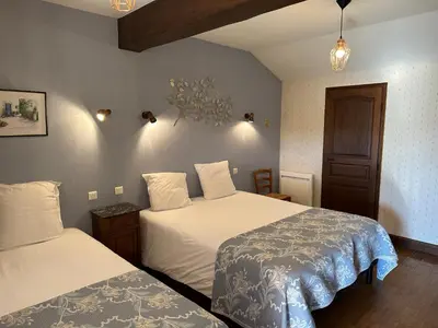 Un ou plusieurs lits dans un hébergement de l'établissement Chambres d'hôtes du puy d'anché