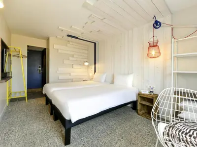 Un ou plusieurs lits dans un hébergement de l'établissement ibis styles La Rochelle Thalasso Chatelaillon