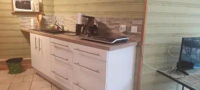 Cuisine ou kitchenette dans l'établissement Gîte cosy, sur jardin, terrasse privée, parking au calme en rdc