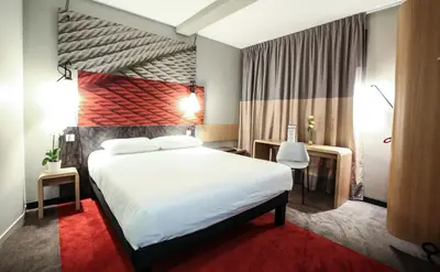 Un ou plusieurs lits dans un hébergement de l'établissement Ibis Niort Est Mendes France