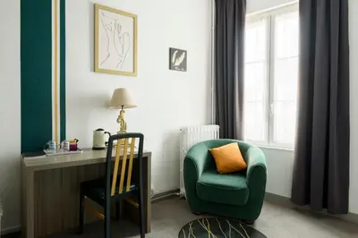 Coin salon dans l'établissement Cit' Hotel de France