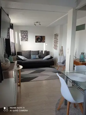 Coin salon dans l'établissement Appartements Les remparts d'Alienor