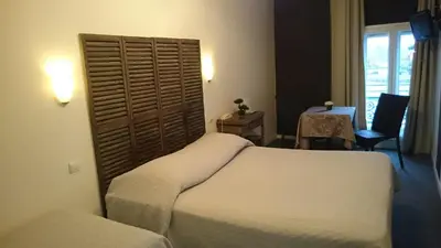 Un ou plusieurs lits dans un hébergement de l'établissement Hôtel de l'Océan