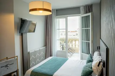 Un ou plusieurs lits dans un hébergement de l'établissement Hôtel Central