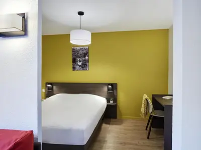 Un ou plusieurs lits dans un hébergement de l'établissement Aparthotel Adagio Access Poitiers