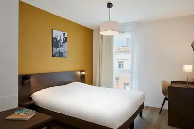 Un ou plusieurs lits dans un hébergement de l'établissement Aparthotel Adagio Access Poitiers