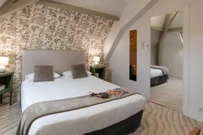 Un ou plusieurs lits dans un hébergement de l'établissement The Originals Boutique, Hôtel Victoria, Châtelaillon-Plage