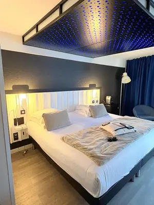 Un ou plusieurs lits dans un hébergement de l'établissement Hôtel La Fabrique