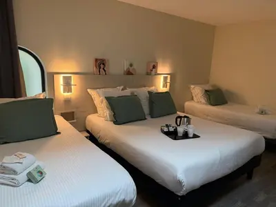 Un ou plusieurs lits dans un hébergement de l'établissement Hôtel La Fabrique