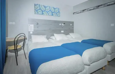 Un ou plusieurs lits dans un hébergement de l'établissement Hôtel Mac Bed