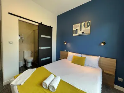 Un ou plusieurs lits dans un hébergement de l'établissement Brit Hotel du Parc Niort Centre-Parking gratuit