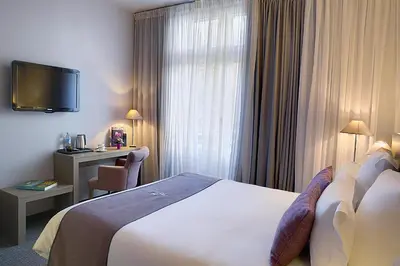 Un ou plusieurs lits dans un hébergement de l'établissement Best Western Hotel de la Breche