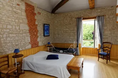 Un ou plusieurs lits dans un hébergement de l'établissement Chambres d'hôtes Les Tilleuls
