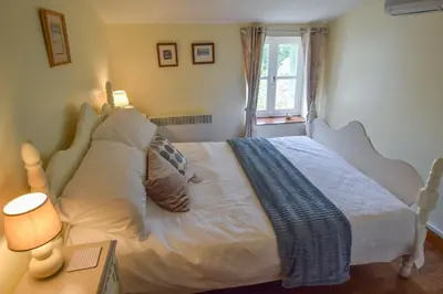 Un ou plusieurs lits dans un hébergement de l'établissement La Maison Muguet