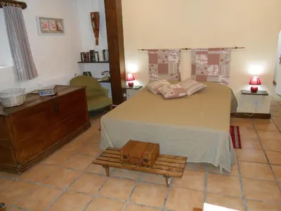 Un ou plusieurs lits dans un hébergement de l'établissement Chambre d'hotes Le Fourniou