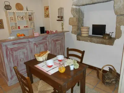 Télévision ou salle de divertissement dans l'établissement Chambre d'hotes Le Fourniou
