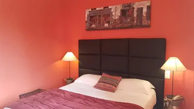 Un ou plusieurs lits dans un hébergement de l'établissement hôtel restaurant Beau-rivage