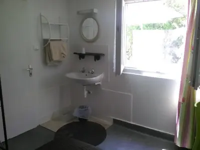 Salle de bains dans l'établissement Le Parisien