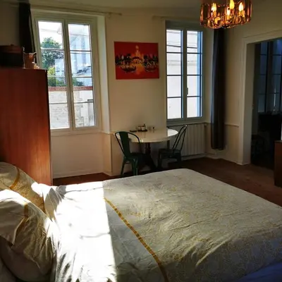 Un ou plusieurs lits dans un hébergement de l'établissement Le Bonheur- Suite Cognac
