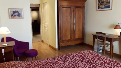 Un ou plusieurs lits dans un hébergement de l'établissement Hôtel du Donjon