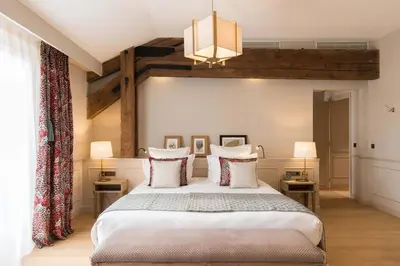 Un ou plusieurs lits dans un hébergement de l'établissement Hôtel Chais Monnet & Spa