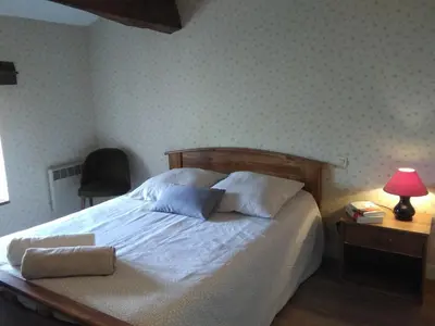 Un ou plusieurs lits dans un hébergement de l'établissement Gîte La Cibulle