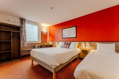 Un ou plusieurs lits dans un hébergement de l'établissement Ace Hotel Poitiers