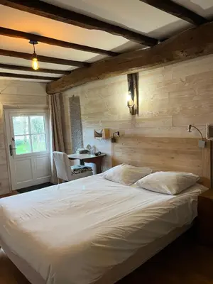 Un ou plusieurs lits dans un hébergement de l'établissement Chambres d'Hôtes - Les Bujours
