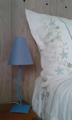 Un ou plusieurs lits dans un hébergement de l'établissement LA MAISON BLEUE