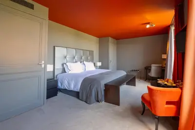 Un ou plusieurs lits dans un hébergement de l'établissement Hotel Ligaro - Jarnac