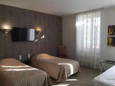 Un ou plusieurs lits dans un hébergement de l'établissement Hôtel Restaurant La Boule d'Or