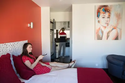 Un ou plusieurs lits dans un hébergement de l'établissement Appart-hôtel Chanzy / Angoulême