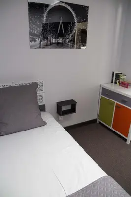 Un ou plusieurs lits dans un hébergement de l'établissement Appart-hôtel Chanzy / Angoulême