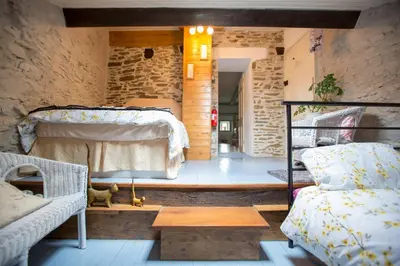Un ou plusieurs lits dans un hébergement de l'établissement La Maison Des Fleurs