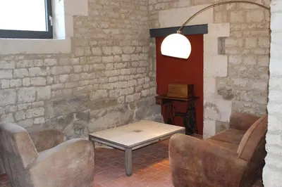 Coin salon dans l'établissement Château des Loups - Les Pommiers