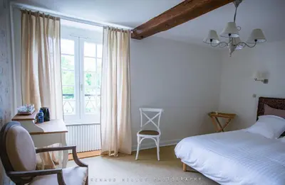 Un ou plusieurs lits dans un hébergement de l'établissement Maison d'hôtes le Moulin de Bois Coûtant