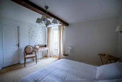 Un ou plusieurs lits dans un hébergement de l'établissement Maison d'hôtes le Moulin de Bois Coûtant