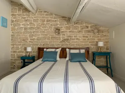 Un ou plusieurs lits dans un hébergement de l'établissement Maison d'hôtes La Chabanaise - Marais Poitevin