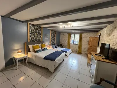 Un ou plusieurs lits dans un hébergement de l'établissement Les Bruyeres Chambres dhotes et Gite