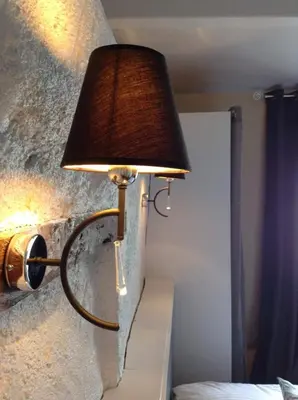Un ou plusieurs lits dans un hébergement de l'établissement Hôtel Restaurant de la Place