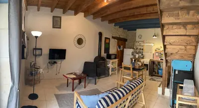 Coin salon dans l'établissement Gites Le Bois de l'Eglise