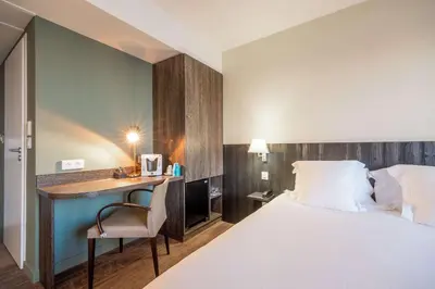Un ou plusieurs lits dans un hébergement de l'établissement Les Flots - Hôtel et Restaurant face à l'océan - Châtelaillon-Plage