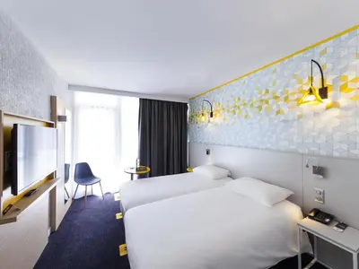 Un ou plusieurs lits dans un hébergement de l'établissement ibis Styles Poitiers Nord