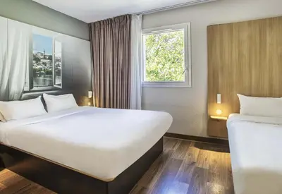 Un ou plusieurs lits dans un hébergement de l'établissement B&B HOTEL Angoulême