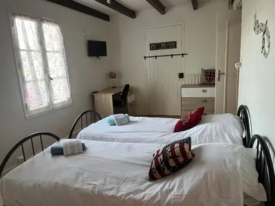 Un ou plusieurs lits dans un hébergement de l'établissement Chez Lysette